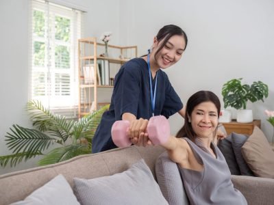 A beautiful female elderly caretaker helps provide health care and check-up for elderly women aged 60 years in the areas of health therapy and the use of medicine to nourish the body..